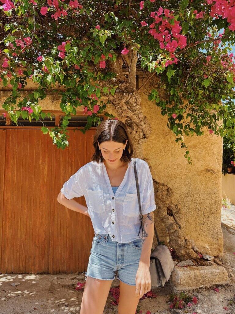 Linds Alyse standing in front of tree in Crete, Greece