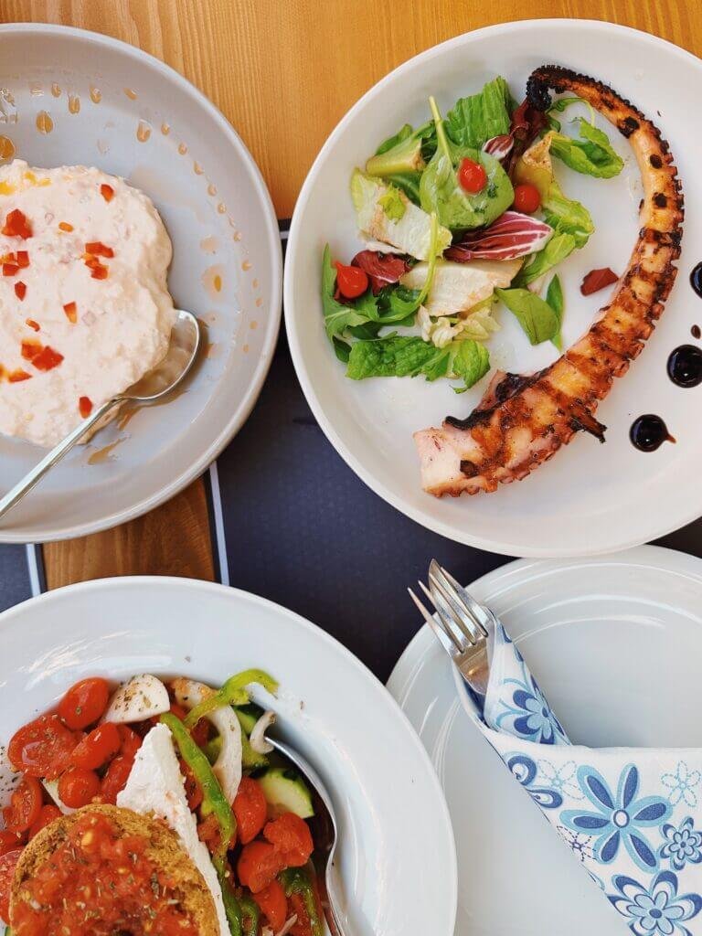 plates of seafood in Crete, Greece with octopus 