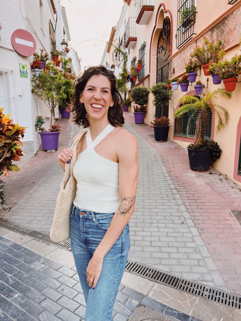 Linds Alyse in a beautiful vibrant alley in Southern Spain. 