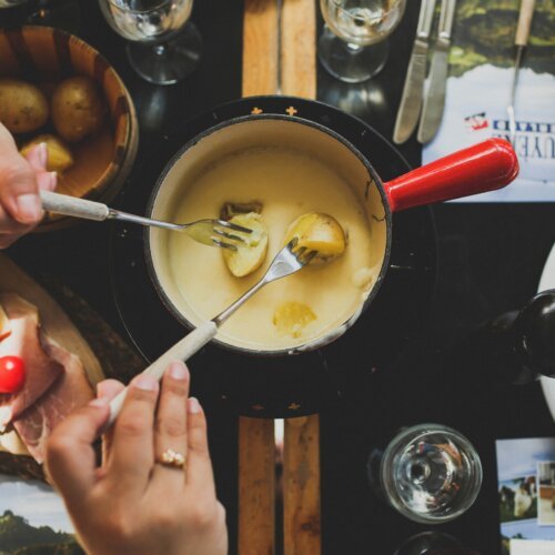 fondue dinner table featuring locations of the best restaurants in Zurich