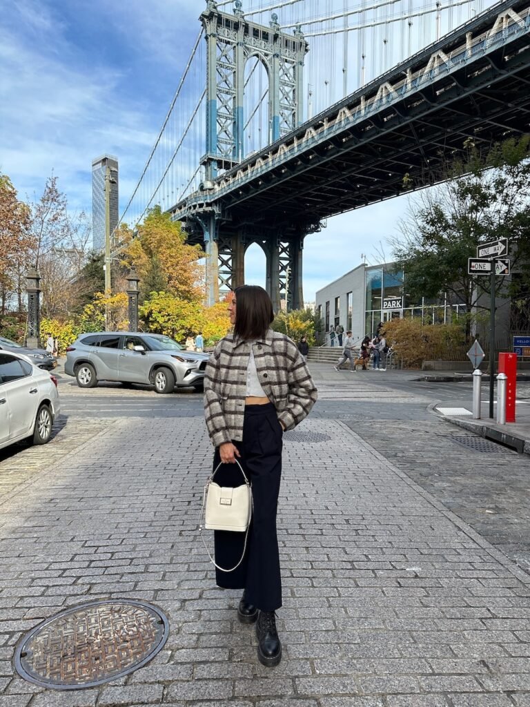 lindsay wearing a plaid cropped wool coat that is a perfect fall outfit for New York weather