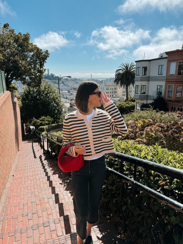 The famously winding Lombard Street, a must-visit attraction in San Francisco for first-time visitors.