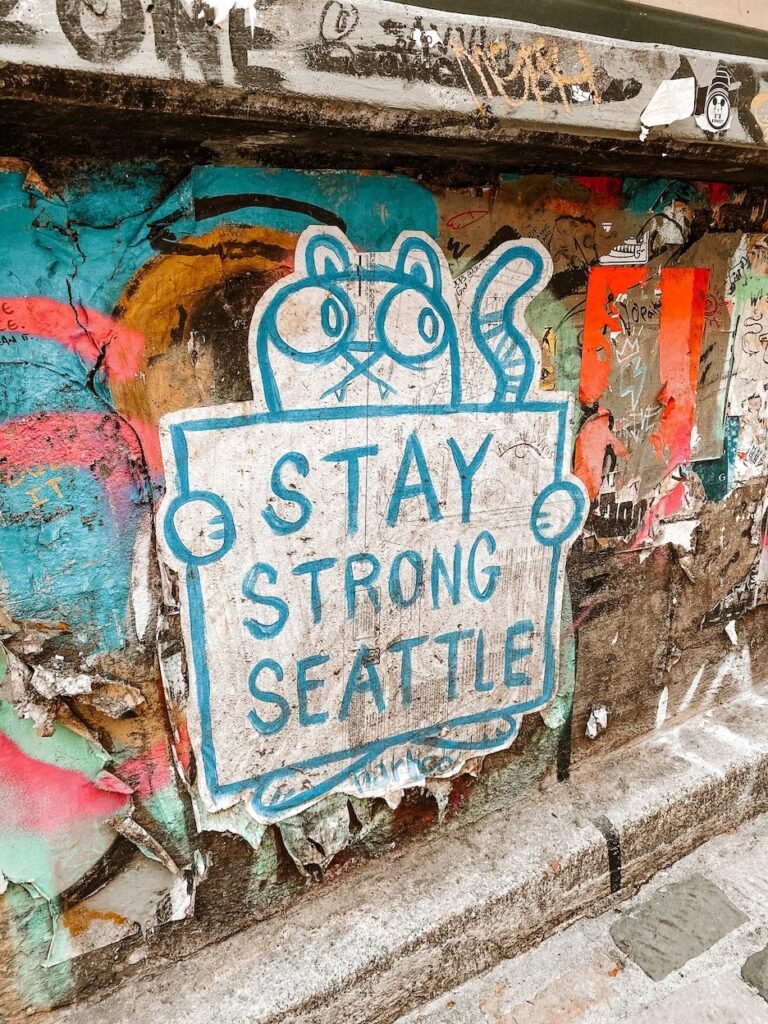 Colorful street art and graffiti decorating walls and windows across Seattle, capturing the city's creative and eclectic spirit.