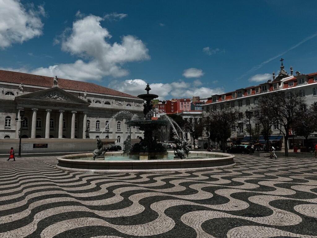 a beautiful image of Rossio square that you will want to make sure to check out during your 48 hours in lisbon, portugal