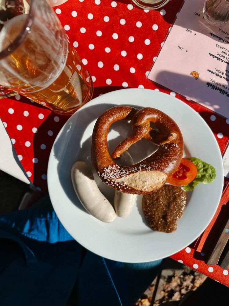 where to eat nürnberg germany featuring a giant Bavarian pretzel and white sausage